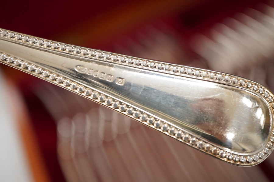 A plated bead edged part canteen of cutlery housed in two cases